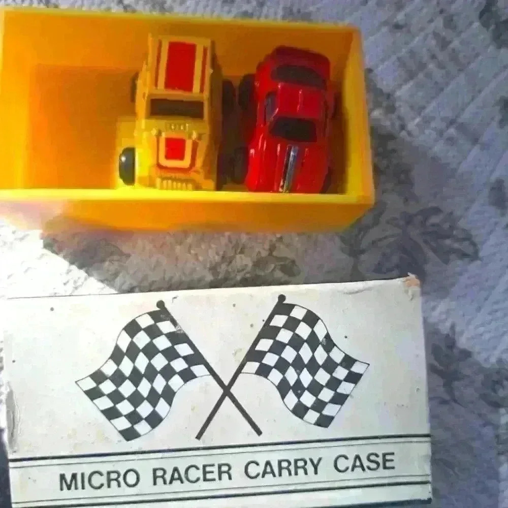 Lot of two vintage Micro Machine cars and Matchbox case